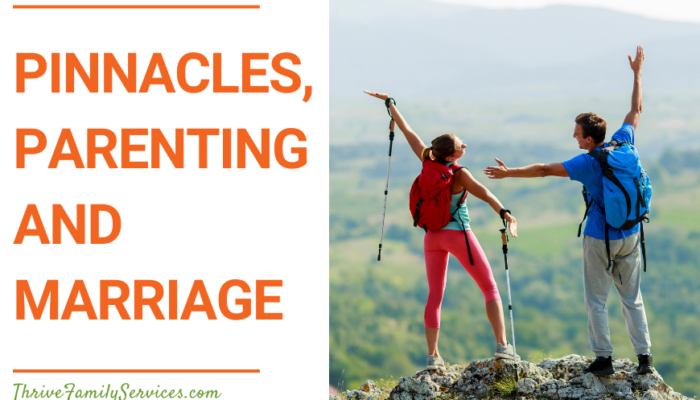 Orange text that says "Pinnacles, Parenting and Marriage" next to a photo of a couple at the summit of a hike. their backs are to the camera and their arms are raised in excitement. they are carrying hiking gear. | Centennial Couples Counseling