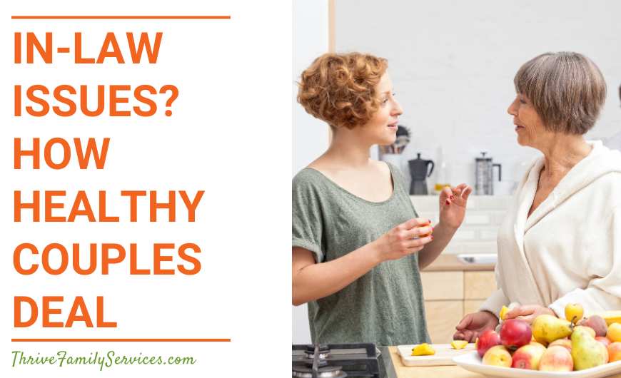 Orange text on a white background that reads "In-Law Issues? How Healthy Couples Deal" to the left of a photo of two women talking to one another in a kitchen. The woman on the left is older than the woman on the right. There is a bowl of fruit in front of them. | Englewood Colorado Family Counseling