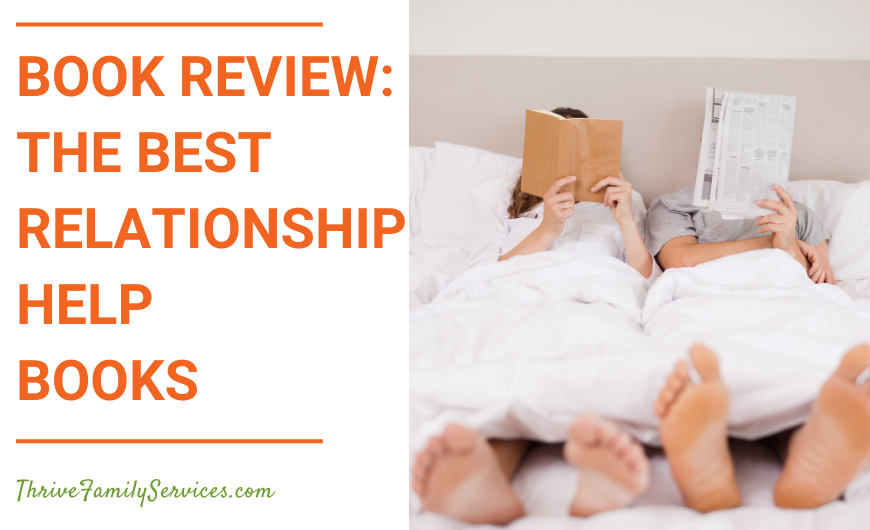 Orange text on a white background that reads "Book Review - The Best Relationship Help Books" to the left of a photo of a white couple laying in bed reading with their books covering their faces. We can see their feet poking out of a white blanket at the end of the bed. | Lone Tree Colorado Relationship Therapy
