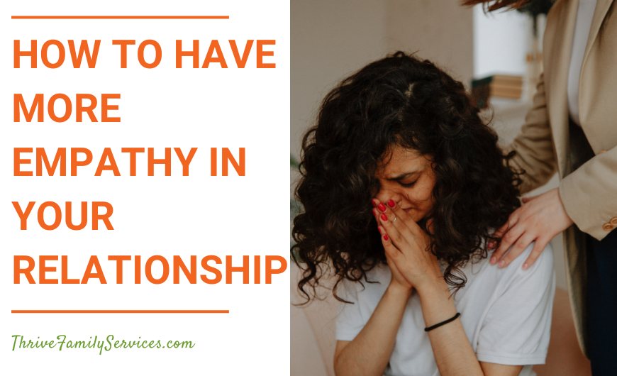 Orange text on a white background that reads "How to Have More Empathy in Your Relationship" to the left of a photo of a couple. A woman is seated, with her head in her hands. She seems upset. A man is behind her, with his hand on his shoulder seemingly to comfort her. We can't see his face. | Aurora Colorado Relationship Counseling