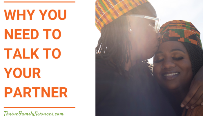 Orange text that reads "Why You Need to Talk to Your Partner" to the left of a photo of a couple. We can see their faces and shoulders. They are both Black women, and the one on the left is kissing the one on the right on the forehead. | Relationship Counselor Greenwood Village Colorado