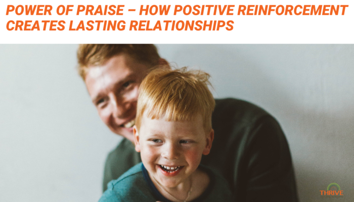 Orange text that reads "The Power of Praise - How Positive Reinforcement Creates Lasting Relationships" above a photo of a man holding a child in front of a neutral background. they are both smiling.