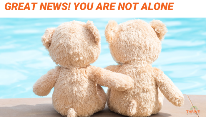 Dark orange text that reads "Great News! You are not alone!" above a stock photo of two teddy bears embracing by the side of a pool.
