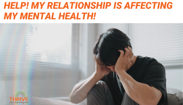 Orange text that reads "Help! My relationship is affecting my mental health" above a photo of a dark haired man holding his head in his hands like he's in distress.