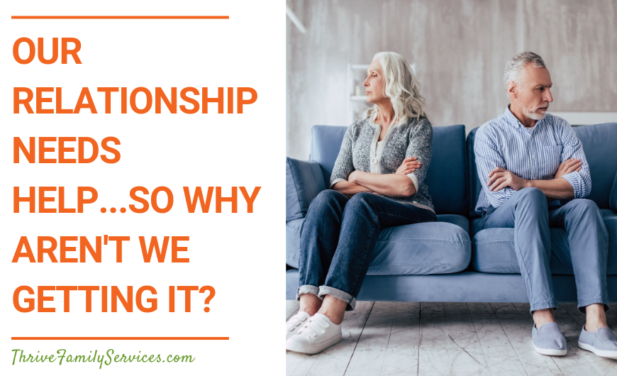 Orange text on a white background that reads "Our Relationship Needs Help...So Why Aren't We Getting It?" to the left of a photo of a white elderly couple sitting on a blue couch, with their arms crossed and facing away from each other. | Englewood Colorado Couples Therapy
