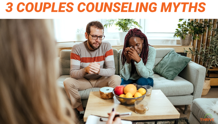 Dark orange text on a white background that reads "3 Couples Counseling Myths" over a stock photo of a white man and a Black woman sitting together on a couch, looking emotional, with the back of a blonde woman's head on the left side, like we're seeing them from her perspective. She's holding a clipboard and taking notes. The logo for Thrive Couple & Family Counseling Services is in the bottom right corner.