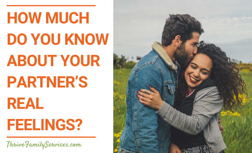 Orange text on a white background that reads "How Much Do You Know About Your Partner’s Real Feelings?" to the left of a photo of a man and a woman outside. They are both wearing jackets and smiling. They are holding each other and the man is kissing the woman on the side of the head. | Greenwood Village Couples Counseling