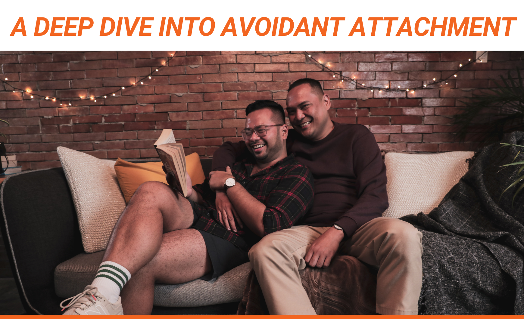 Orange text that reads "A Deep Dive Into Avoidant Attachment" above a stock photo of a happy, gay couple sitting on a couch together.